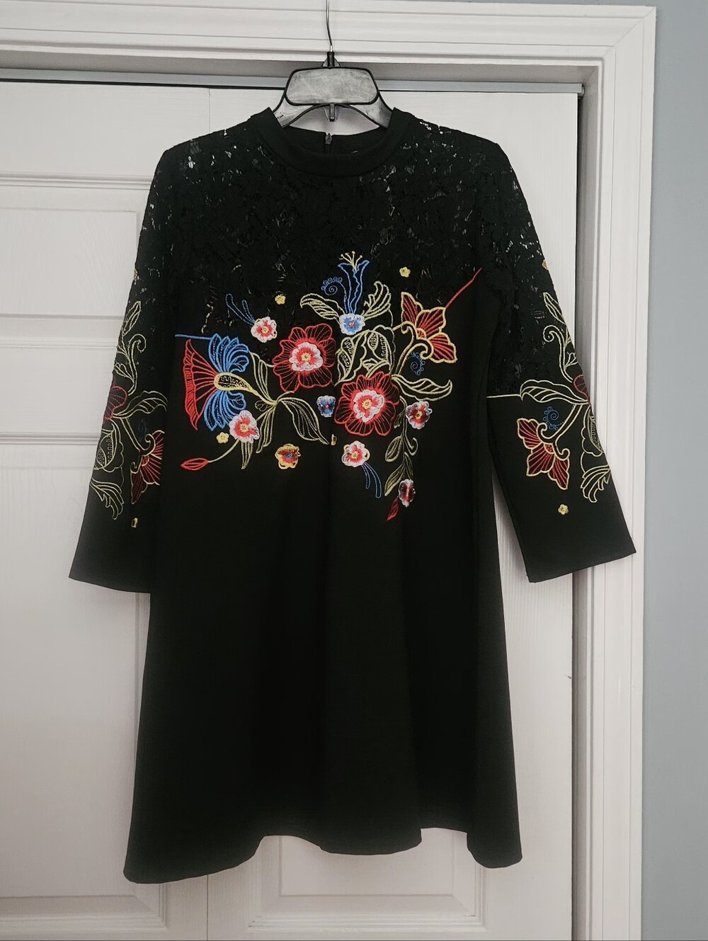 Vicky and Lucas black minidress with embroidered floral design & lace detailing